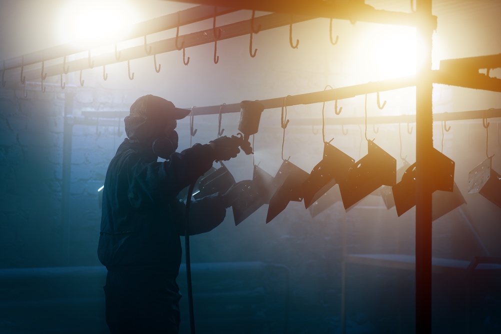 Powder coating parts hanging from hooks